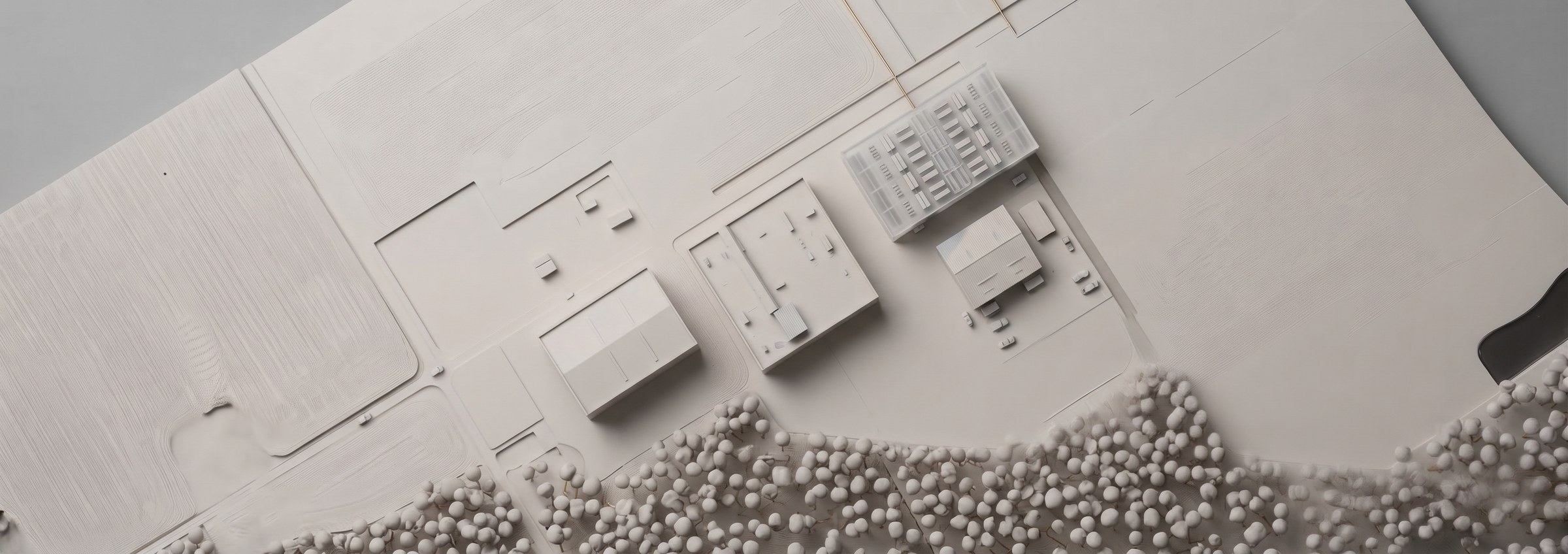 A model of the site from above: the compute buildings, the plant yards and the tree line