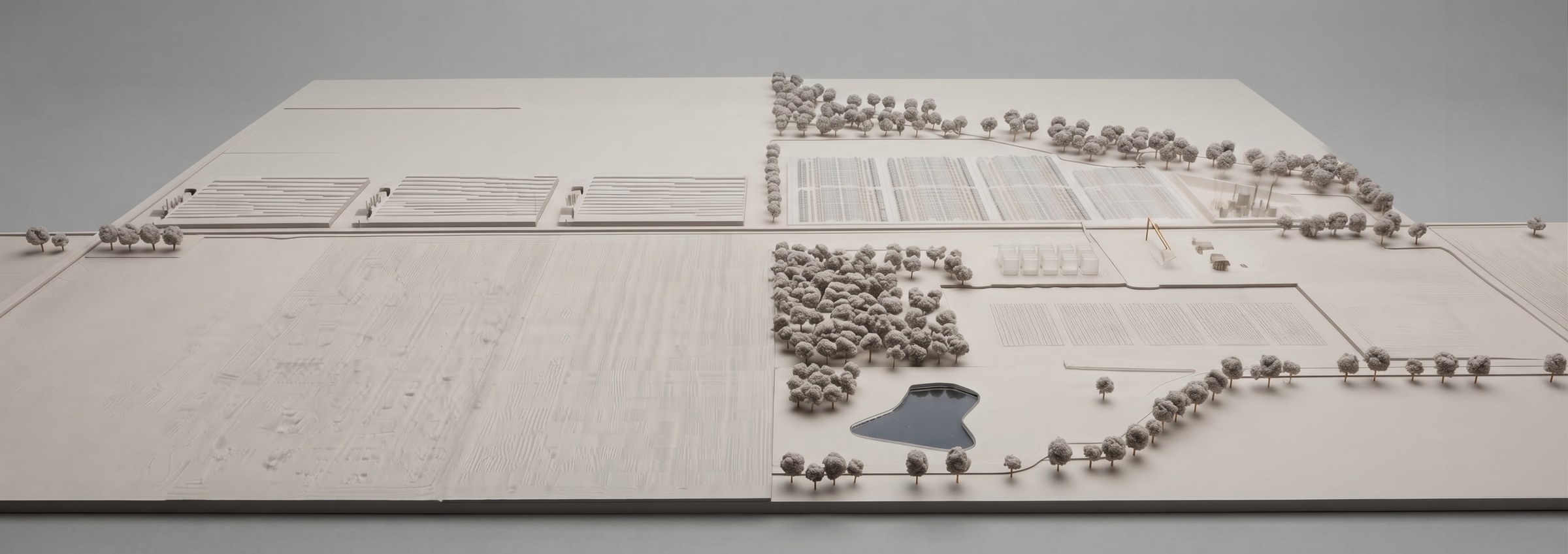 A model of the whole property: glasshouses, tree lines, the pond and open ground