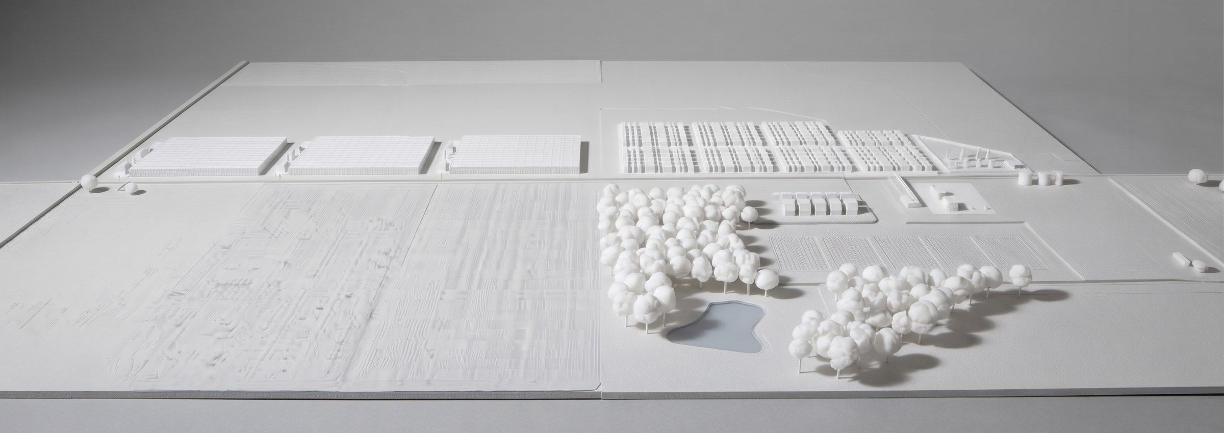 A white model of the whole property, compute buildings, glasshouses, woodland and pond